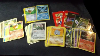Lot Pokémon : 57 cartes + 12 stickers + 2 sachets Merlin